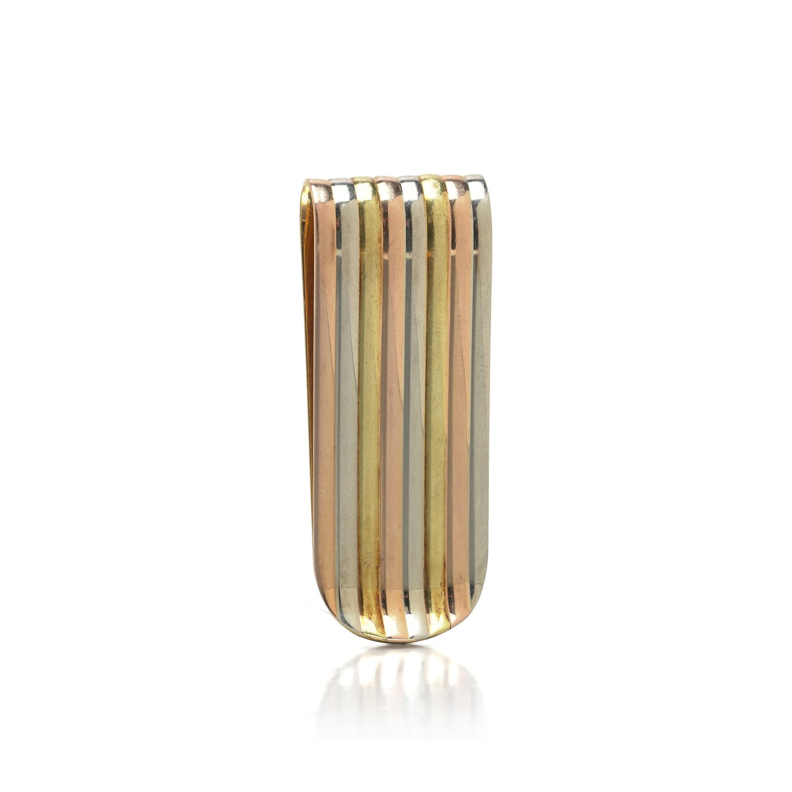 Bulgari Tricolour 18KT Gold Fluted Money Clip, Vintage: Bulgari money clip in tricolour 18KT gold, the face laid in alternating ribs of yellow, white and rose gold that run its full length and turn over the rounded end. Each rib is polished and set slightl