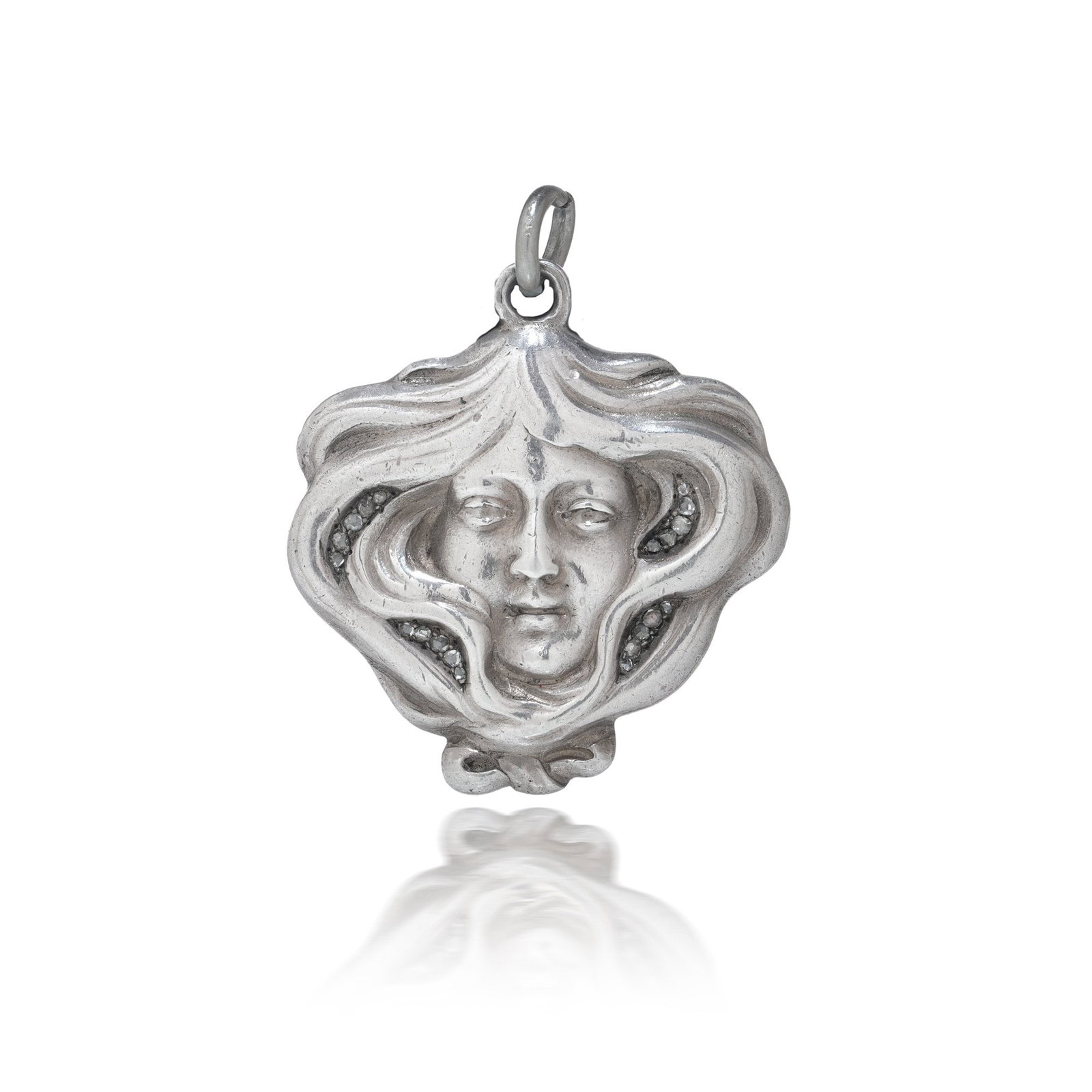 Russian Faberge Art Nouveau Silver Pendant: An antique Russian pendant dating to the early 20th century, executed in silver and attributed to the Faberge workshop. The pendant is modelled in the Art Nouveau style, featuring a sculptural female 