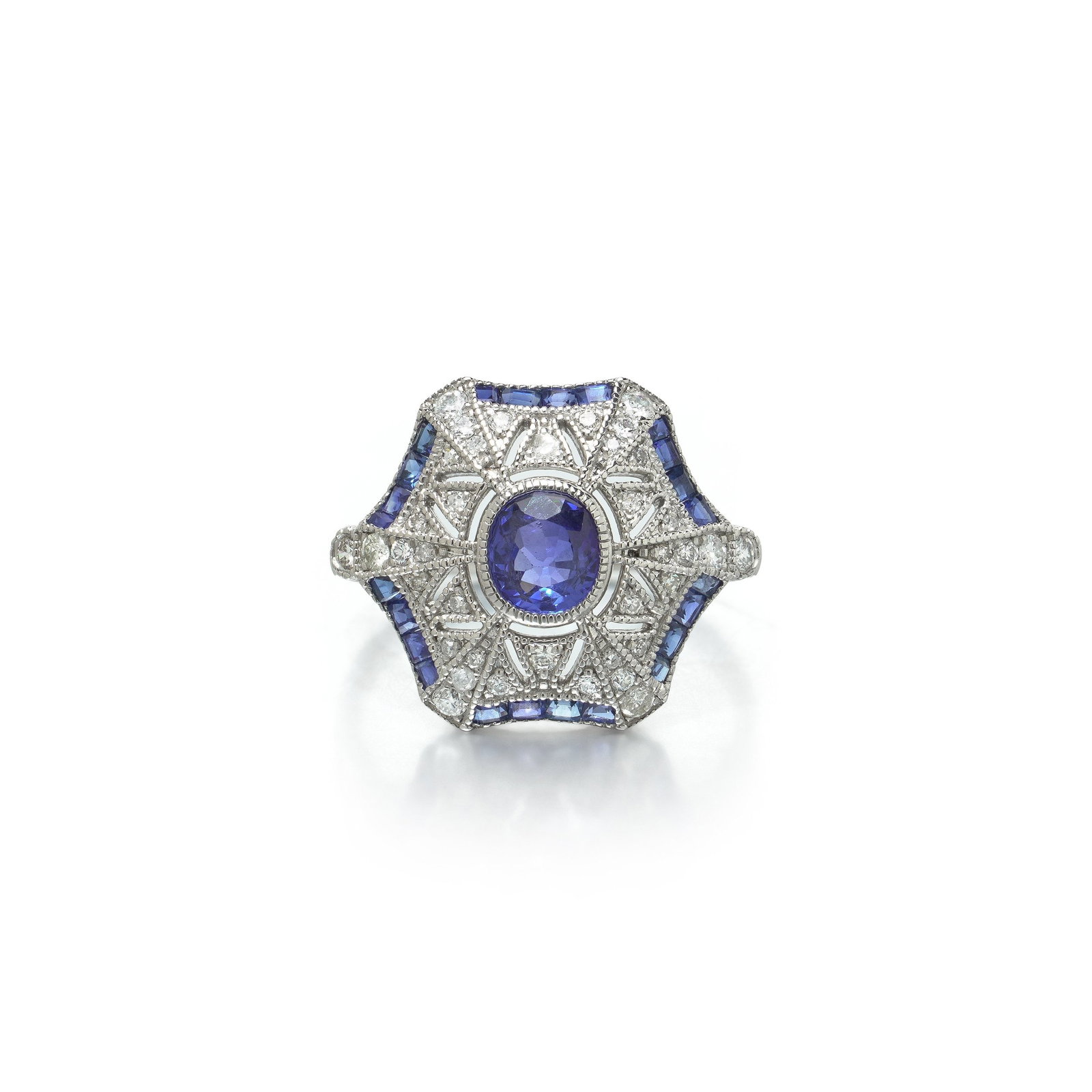 Art Deco Style Platinum Sapphire and Diamond Hexagonal Star Ring: Art Deco style platinum ring , the hexagonal plaque set with an oval sapphire within a diamond star and a border of calibre cut sapphires. The plaque is drawn as a hexagon with the points pulled out a