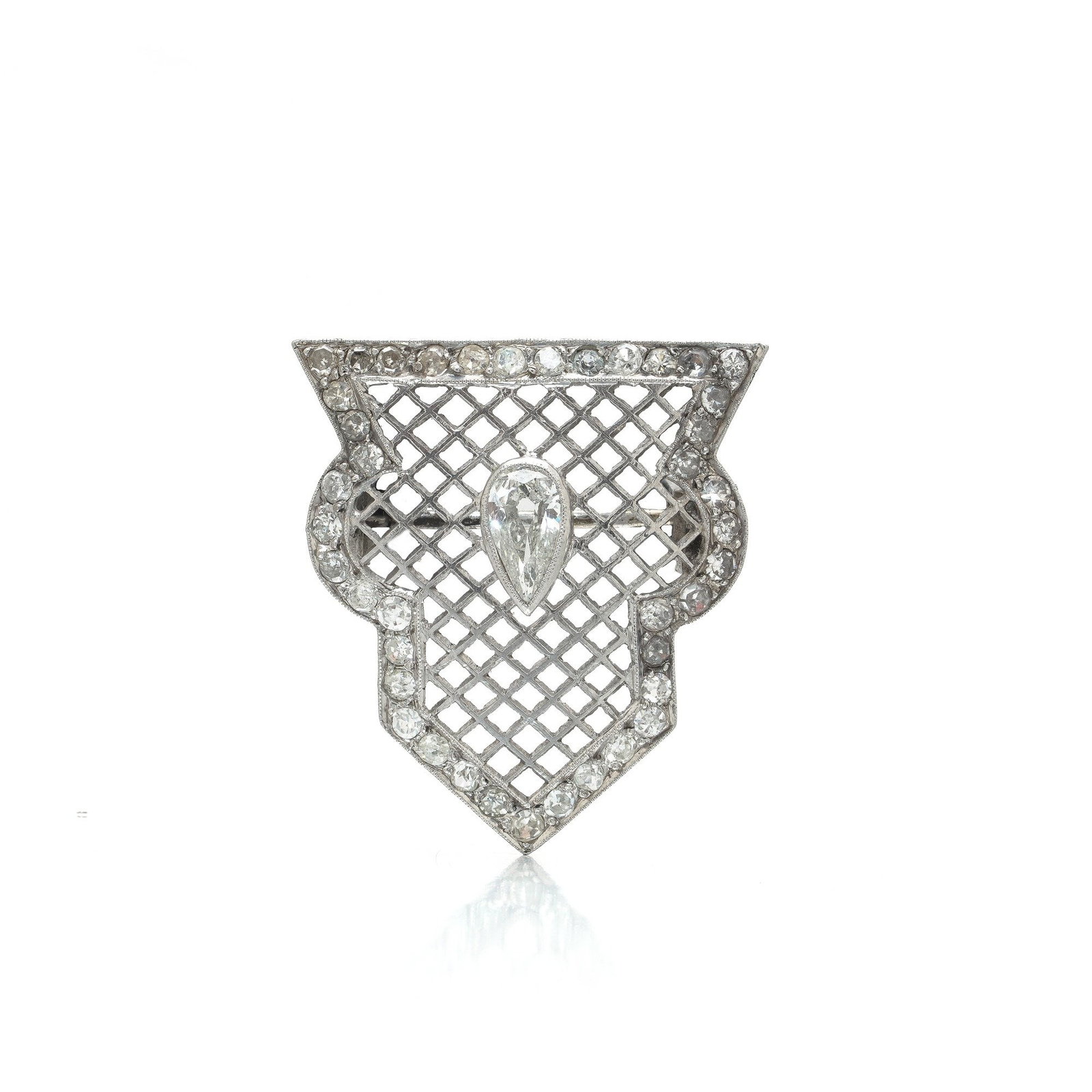 Art Deco Diamond Brooch, Platinum: An Art Deco brooch in platinum, built as a geometric openwork plaque with a pear-shaped old-cut diamond suspended at its heart and a dense field of smaller old cuts filling the pierced lattice around 