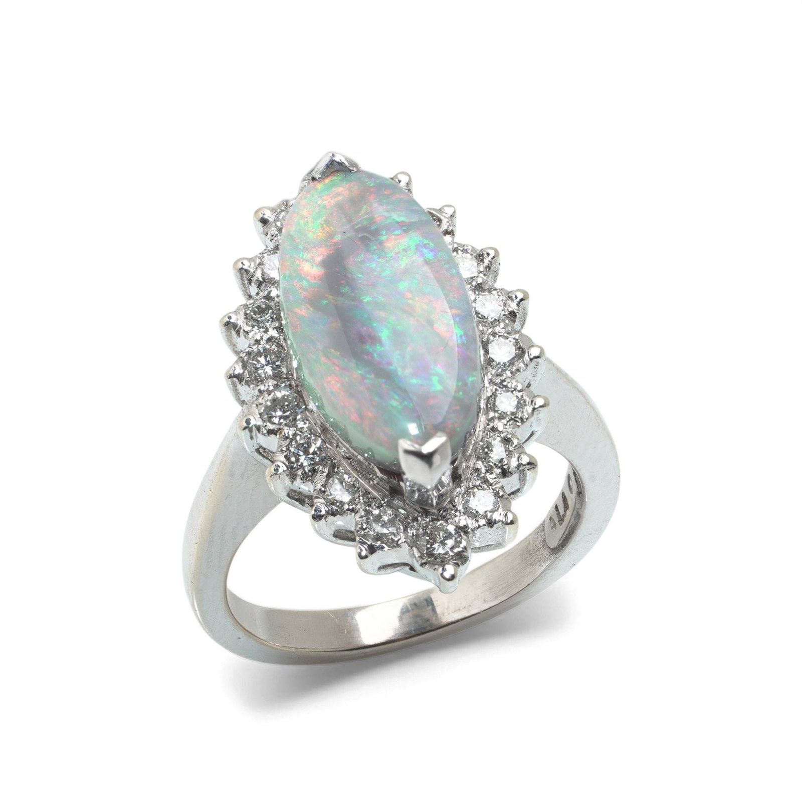 Vintage 14KT White Gold Opal and Diamond Cluster Ring: A vintage ring crafted in 14KT white gold, set with a marquise-shaped opal displaying strong play-of-colour with flashes of green, pink, and orange. The opal is secured within a claw setting and surro