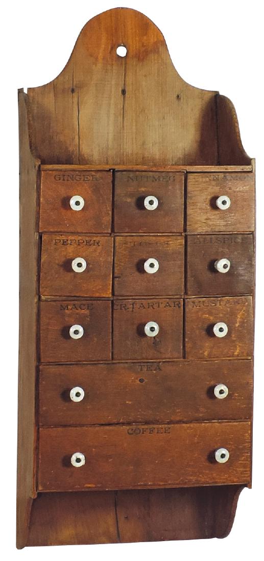 Kitchenware, hanging spice cabinet, primitive 11 drwrs: Kitchenware, hanging spice cabinet, primitive 11 drwrs w/pressed lettering & porcelain pulls, late 1800's, VG cond, 25"H x 10"W.