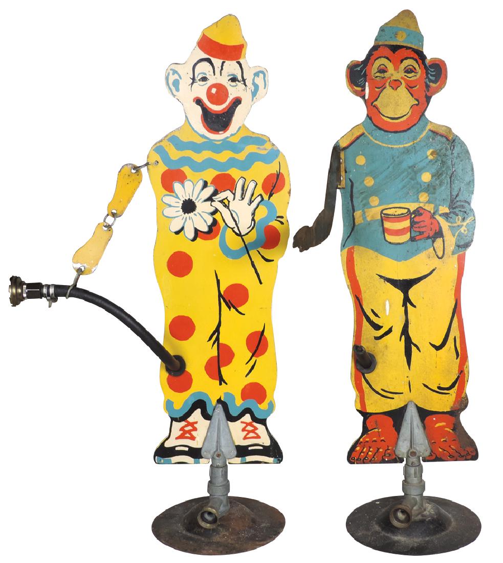 Lawn sprinklers (2), Sprinkling Sam clown & Sprinkling: Lawn sprinklers (2), Sprinkling Sam clown & Sprinkling Bozo monkey, double-sided metal, both in VG cond, monkey has incomplete hose, 30"H.