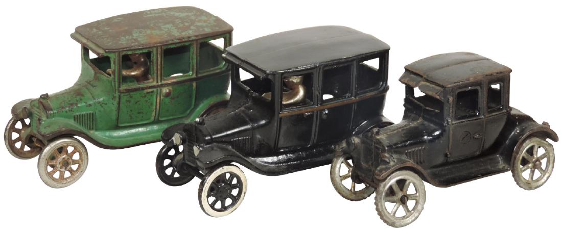 Toy cars (3), 2 Arcade touring, c.1930, cast iron,: Toy cars (3), 2 Arcade touring, c.1930, cast iron, manufacturer's mark on interior, 1 repainted & other orig worn paint & unmarked Arcade touring car, cast iron w/some paint loss, all VG/VG+ cond, up 