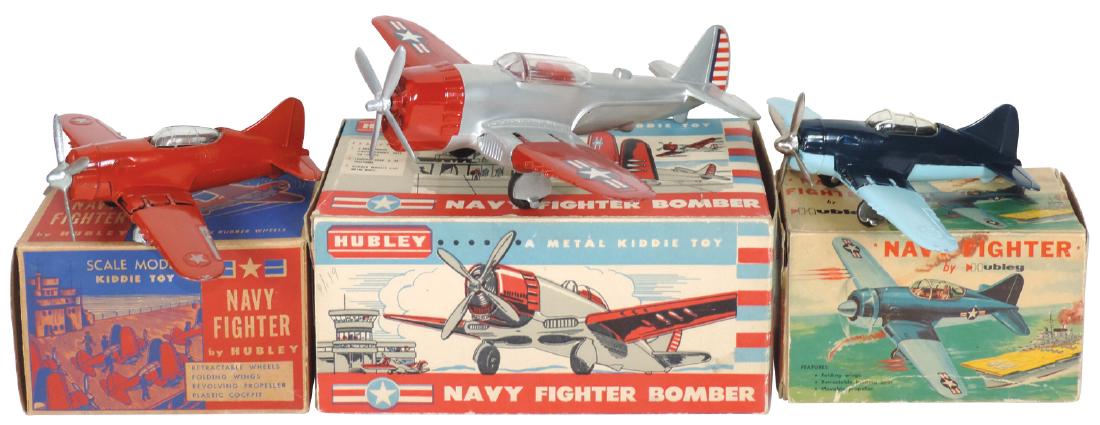 Toy airplanes (3), Hubley: (2) #467 (1) red w/old style: Toy airplanes (3), Hubley: (2) #467 (1) red w/orig old style box (box good), plane VG cond (1) dark blue w/light blue wings w/orig box (box good) plane Near-Mint cond & #495 P-47, silver/red w/wing & 