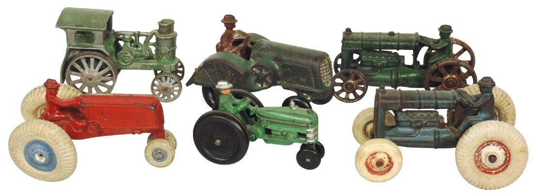 Toy tractors (6), 2 Oliver (one Arcade w/balloon: Toy tractors (6), 2 Oliver (one Arcade w/balloon tires), Avery w/balloon tires, Arcade & unmarked, all cast iron w/some paint loss, Good/VG+ cond, up to 5.5"L.