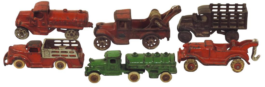 Toy trucks (6), most Hubley & Arcade, (2) tow/wreckers,: Toy trucks (6), most Hubley & Arcade, (2) tow/wreckers, (2) gasoline/oil & (2) stake trucks, all cast iron w/orig paint, Good/VG cond, up to 5.5"L.