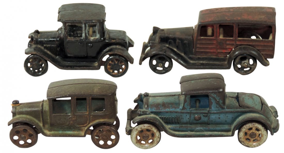 Toy cars (4), Arcade sedan, c.1920's; Model A; (1): Toy cars (4), Arcade sedan, c.1920's; Model A; (1) unmarked & (1) unmarked coupe w/hinged rumble seat, all cast iron w/orig paint, VG/VG+ cond, up to 2.5"H x 6"L.