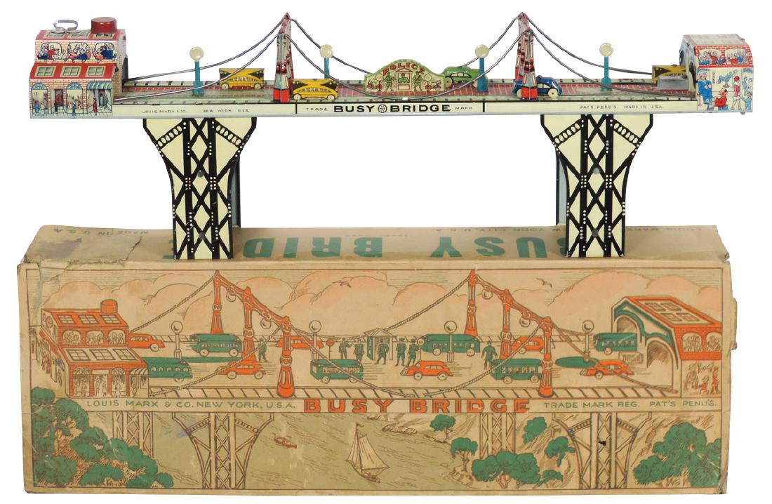 Toy w/box, Busy Bridge, litho on tin windup, mfgd by: Toy w/box, Busy Bridge, litho on tin windup, mfgd by Louis Marx, c.1930's, toy in Exc cond, orig box Good w/missing end flaps, 8"H x 24"W x 4"D.