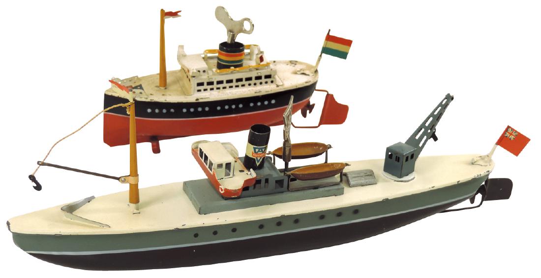 Toy boats (2), Arnold passenger & freight ships,: Toy boats (2), Arnold passenger & freight ships, painted metal w/windup mechs, Exc cond, 6" & 12"L.