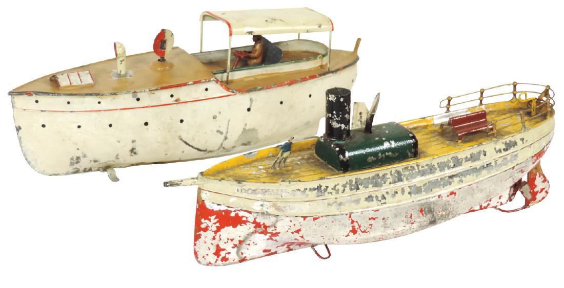Toy boats (2), German freighters, one marked "Dolphin": Toy boats (2), German freighters, one marked "Dolphin", both painted metal w/windup mechs, Good cond w/some missing paint, both 11"L.