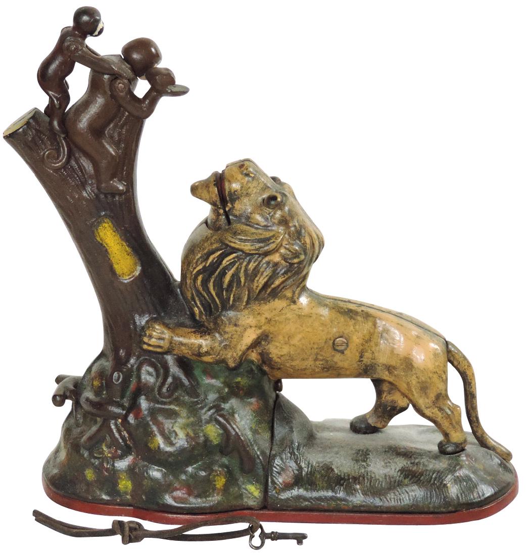 Mechanical bank, "Lion and Two Monkeys," mfgd by Kyser: Mechanical bank, "Lion and Two Monkeys," mfgd by Kyser & Rex, cast iron w/repaint, VG+ wkg cond w/key, 9.5"H x 9"W.
