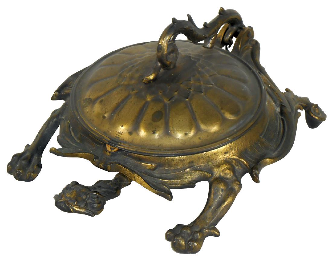 Spittoon, turtle, cast iron body w/cast iron receiver,: Spittoon, turtle, cast iron body w/cast iron receiver, mfgd by Bradley & Hubbard, press on head to raise shell, Exc cond w/orig brass flashing, 6.5"H x 12"L.