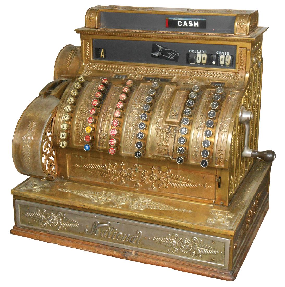 National Cash Register Model 97, all brass/bronze: National Cash Register Model 97, all brass/bronze cabinet w/oak base, 9 clerk compartments w/receipt writer, c.1900, VG wkg cond, 21"H x 23"W x 15"D.