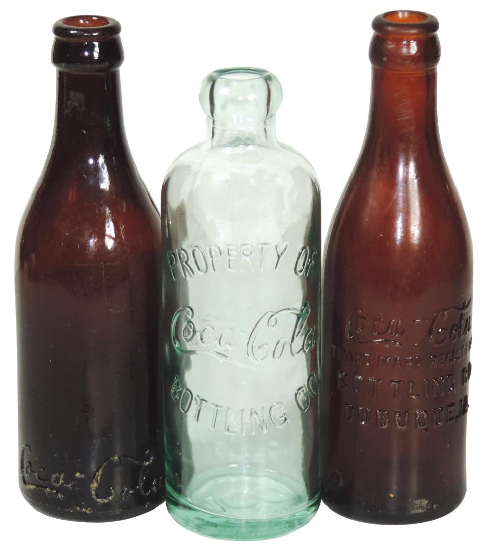 Coca-Cola bottles (3), amber "Coca-Cola-Trade Mark: Coca-Cola bottles (3), amber "Coca-Cola-Trade Mark Registered-Bottling Co.-Dubuque, IA."; amber "Coca-Cola Huntsville, Ala." at bottom & 1986 Centennial Celebration green Hutchinson bottle, all Exc co