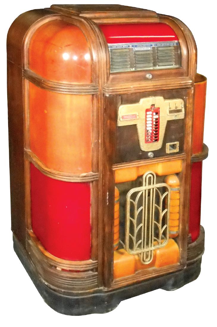 Coin-operated jukebox, Rockola Standard Luxury Lightup,: Coin-operated jukebox, Rockola Standard Luxury Lightup, c.1939, as-found cond, missing upper right plastic, o/wise appears largely complete, 55"H x 35"W x 25"D.