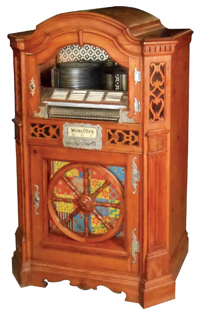 Coin-operated jukebox, Wurlitzer Model 780-E, Serial: Coin-operated jukebox, Wurlitzer Model 780-E, Serial #773647, machine looks complete inside, including slug rejector & grinder, some cosmetic issues w/loose veneer on top, Good orig cond and it works.