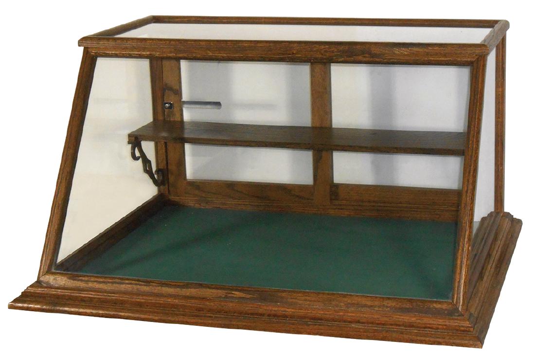 Country store countertop showcase, oak slant top,: Country store countertop showcase, oak slant top, custom made w/shelf & wood brackets, a great look & size, Exc cond w/lock & key, 18"H x 36"W x 24"D.
