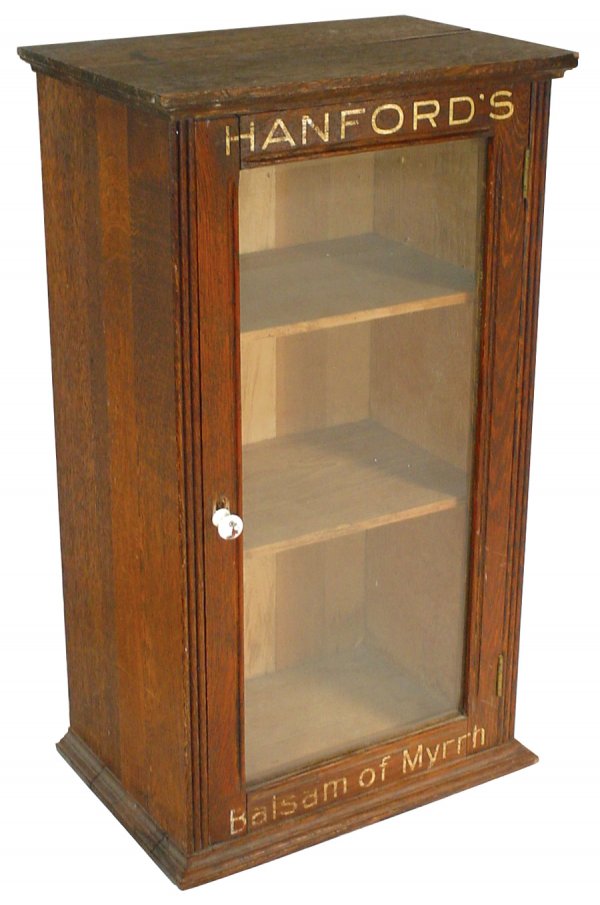 Veterinary display case for Hanford's Balsam of My: Veterinary display case for Hanford's Balsam of Myrrh, oak w/glass door, a great counter display case in VG+ condition w/replacement knob, c.1890's, 24.5"H x 14"W x 9.5"D.