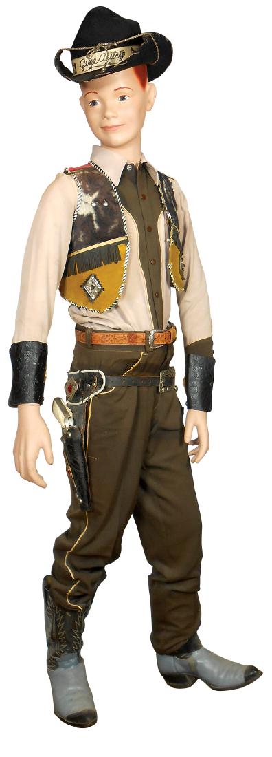 Mannequin w/Gene Autry attire, composition, suede-front: Mannequin w/Gene Autry attire, composition, suede-front vest w/simulated fur trim, hat, shirt, belt, boots, tooled leather cuffs, double holster w/cap guns, mannequin Exc cond, 5'H; rest VG cond.