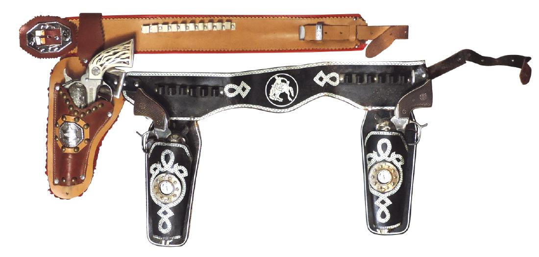 Toy cap guns & holsters (2), Cowhand double holster: Toy cap guns & holsters (2), Cowhand double holster w/guns by Geo. Schmidt, 32"L, Good cond & Marshal holster w/Huley gun, VG wkg cond.
