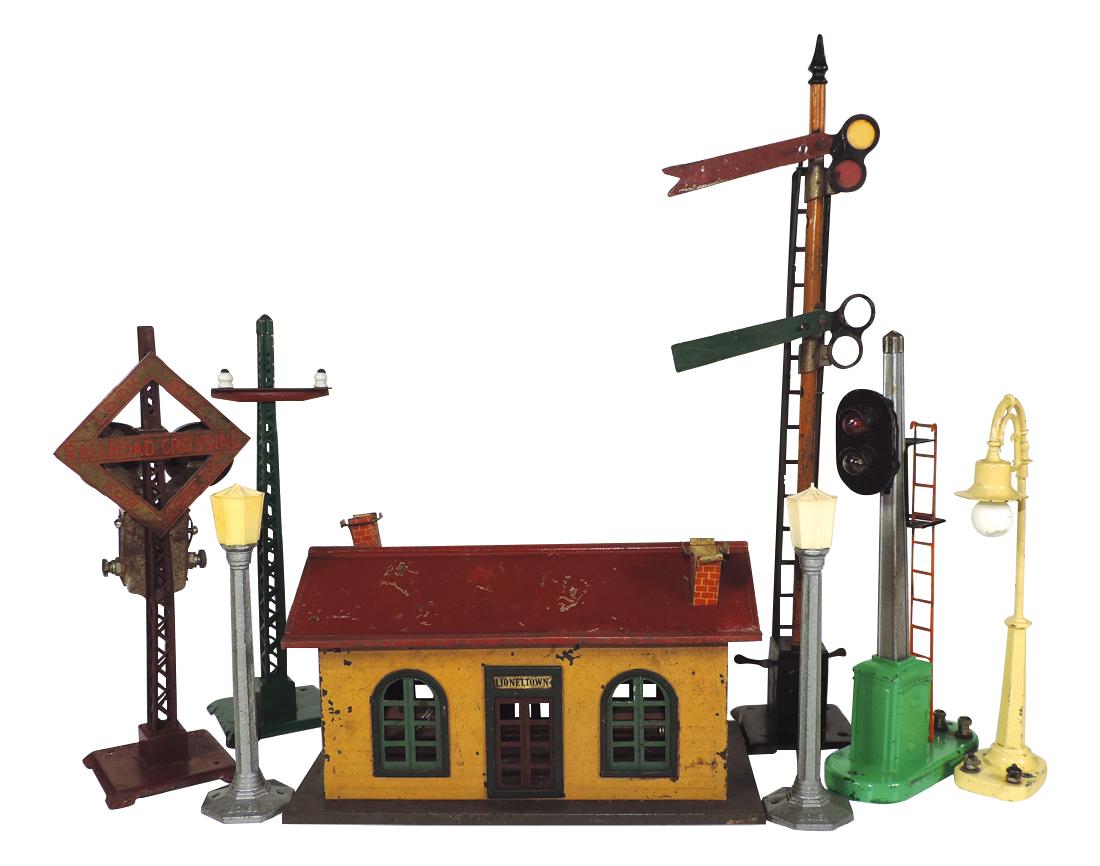 Toy train accessories (8) Lionel #127 station, 2 street: Toy train accessories (8) Lionel #127 station, 2 street lights, gooseneck street light #58-19, automatic block signal, #068 Lookout Crossing w/bells, #060 Prewar telephone pole & unmarked flag tower,