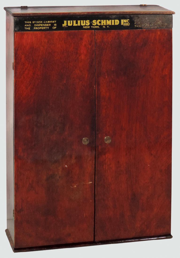 Drug store condom display, Julius Schmid Sheik, wood: Drug store condom display, Julius Schmid Sheik, wood box w/flip top & hinged doors, interior litho on tin w/adv panels, VG cond w/some loss on top panel, 17.5"H x 12"W.