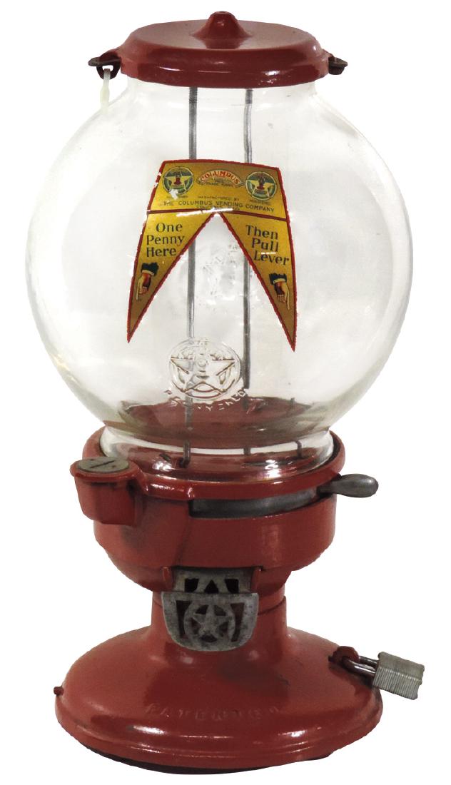 Coin-operated pistachio vendor, Columbus Model A, 1: Coin-operated pistachio vendor, Columbus Model A, 1 Cent, very unusual, cast iron w/orig globe & decal, Exc wkg cond w/lock but no key, 17"H.