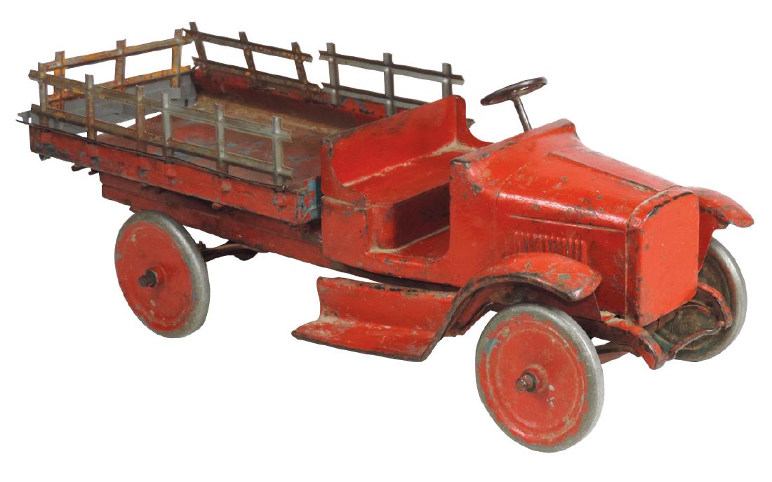Toy Buddy "L" Stake Truck, painted pressed steel,: Toy Buddy "L" Stake Truck, painted pressed steel, crimped front bumper, low-sided cargo bed w/5 removeable stake sections, missing decals, Good+ older repainted cond, 25"L.