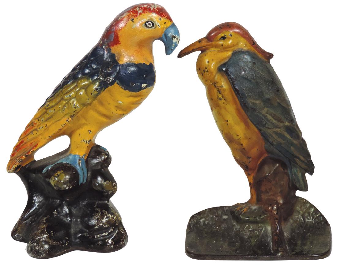 Doorstops (2), Standing Heron, marked 83, Albany: Doorstops (2), Standing Heron, marked 83, Albany Foundry Co. & Parrott, marked KS, both painted cast iron w/hollow-backs, both Exc cond, 8" & 7.5"H.
