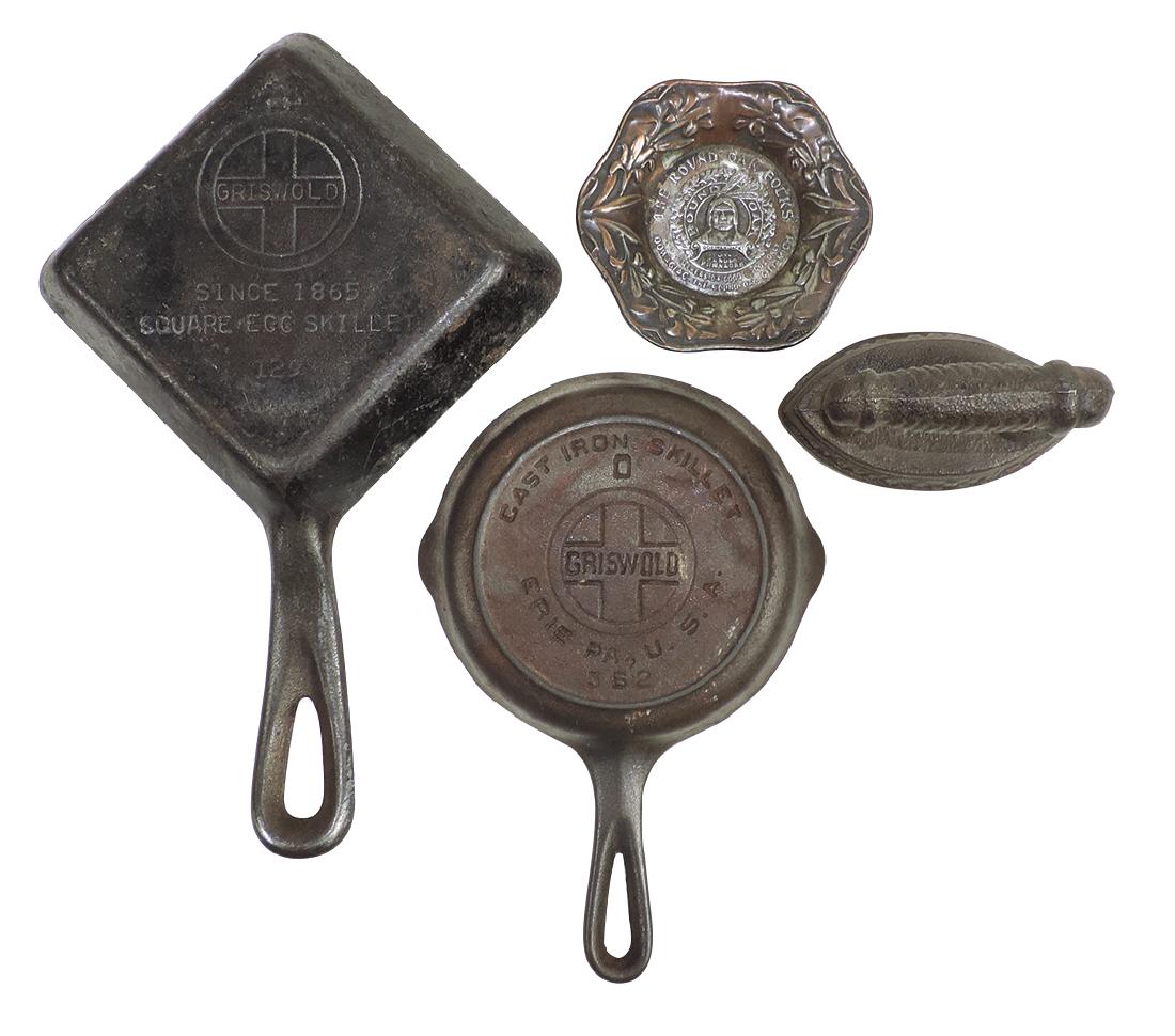 Stove advertising & child's cast iron cookware (4),: Stove advertising & child's cast iron cookware (4), Round Oak Stoves & Ranges sad iron paperweight, Round Oak metal tray w/Indian logo, Griswold square egg skillet No.129 & Griswold cast iron skillet 