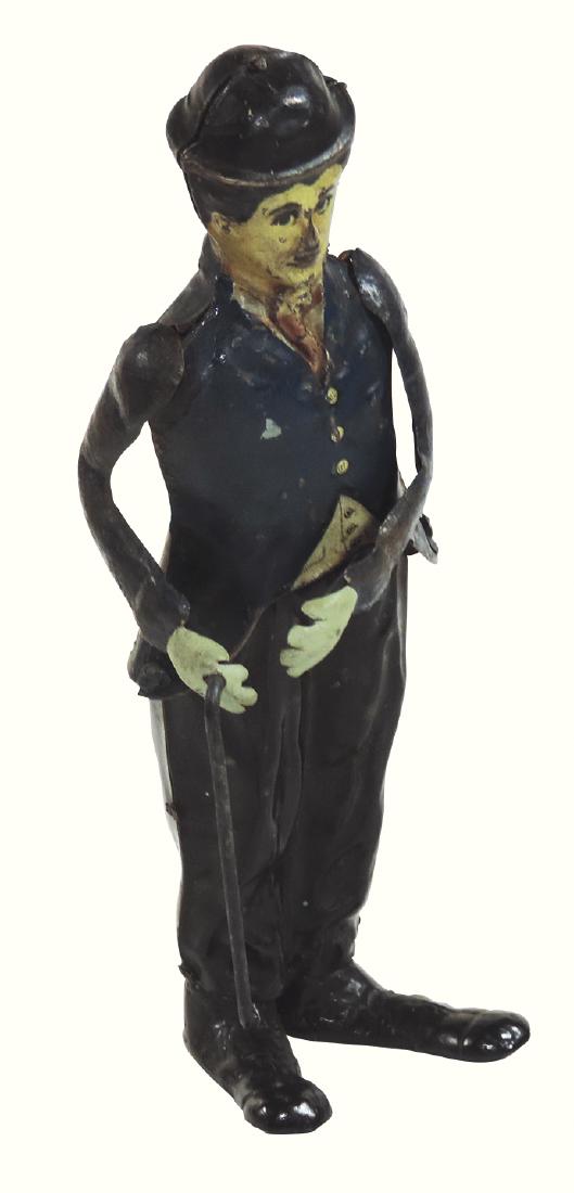 Toy Charlie Chaplin windup, mfgd by: Toy Charlie Chaplin windup, mfgd by Gunthermann-Germany, Rare, c.1919, litho on tin except feet are made of iron to help balance, minor paint loss, o/wise VG working cond w/no key, 8.5"H.