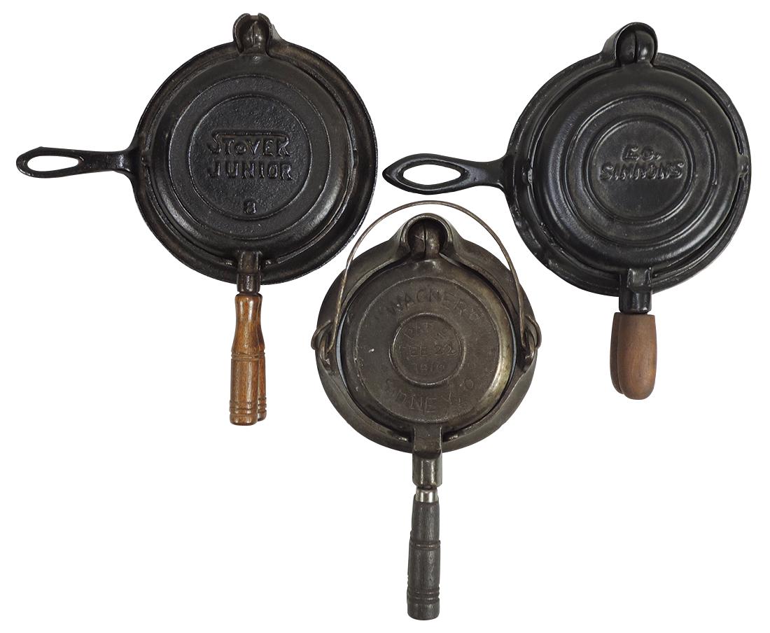 Children's or Salesman Sample cookware (3), cast iron: Children's or Salesman Sample cookware (3), cast iron waffle irons, Wagner, patd Feb 22, 1920, Stover Junior No. 8 & E. G. Simmons Keen Kutter, all Exc cond, up to 5"Dia.