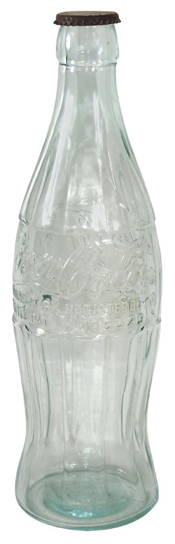 Coca-Cola oversized embossed glass bottle w/orig metal: Coca-Cola oversized embossed glass bottle w/orig metal cap, bottle Exc w/some wear on cap, 20"H.
