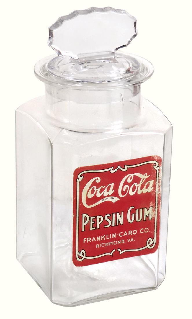 Coca-Cola Pepsin Gum jar, mfgd by Franklin-Caro Mfg: Coca-Cola Pepsin Gum jar, mfgd by Franklin-Caro Mfg Co.-Richmond, VA, embossed glass jar w/ground neck & stopper, older reproduction label, Exc cond w/minor label wear, 11"H.