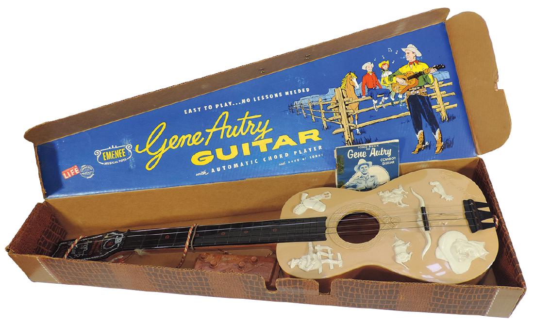 Toy Gene Autry guitar in orig display box w/chord: Toy Gene Autry guitar in orig display box w/chord player & song book, mfgd by Emenee Musical Toys, c.1950's, Exc cond, 32"L x 11"W.