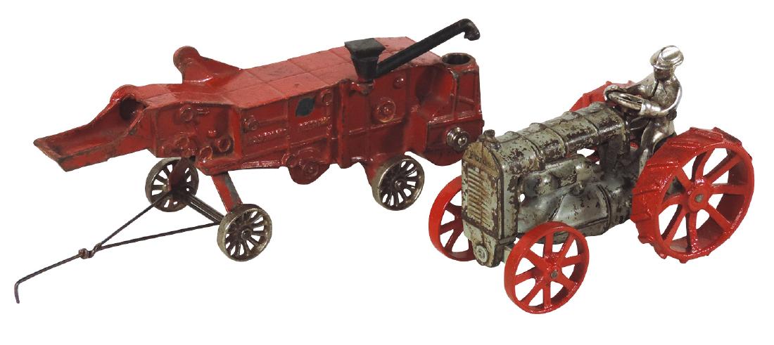 Toy Arcade McCormick-Deering tractor & thresher (2),: Toy Arcade McCormick-Deering tractor & thresher (2), cast iron w/orig paint w/repaint on tractor wheels, VG+ cond w/orig Arcade transfer on thresher, 6" & 9.5"L.