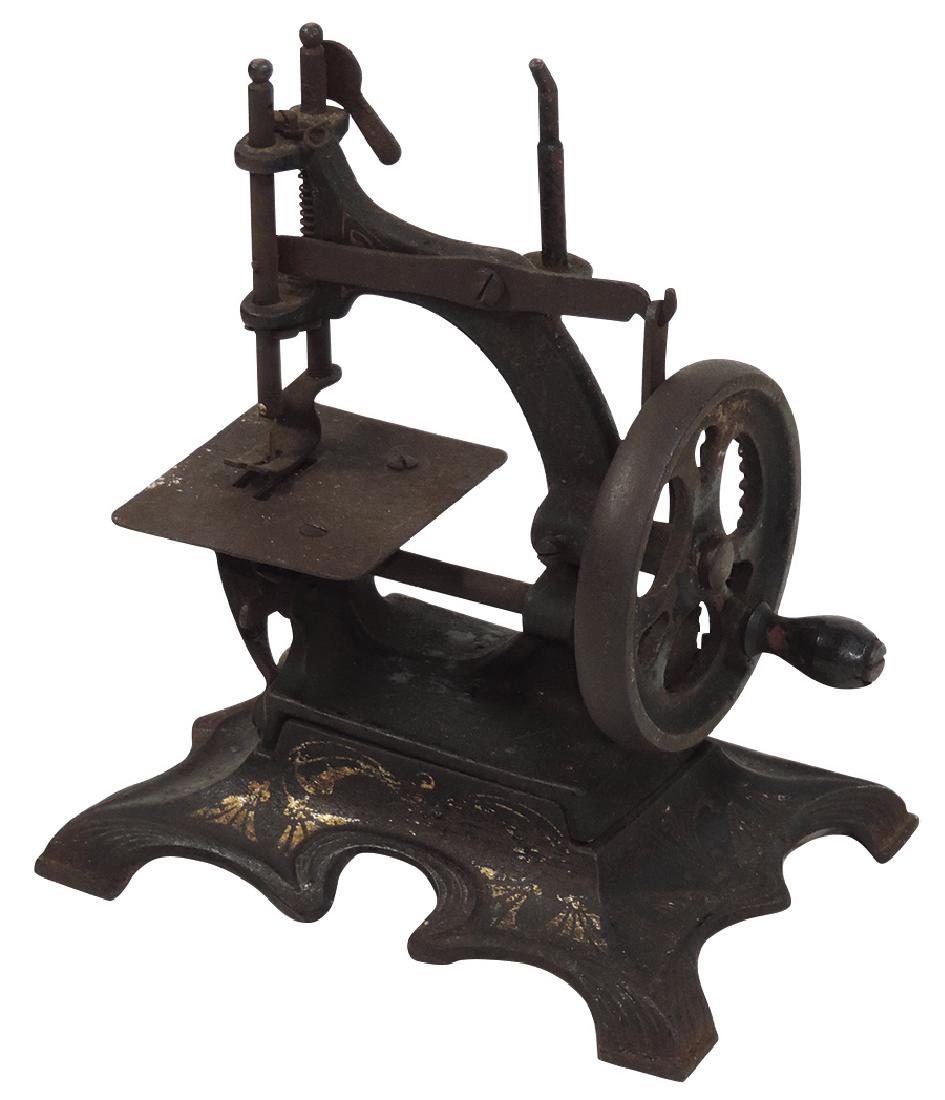 Toy sewing machine, cast iron w/orig paint &: Toy sewing machine, cast iron w/orig paint & stenciling, early 1900's, VG orig working cond, 7.25"H x 6"W.