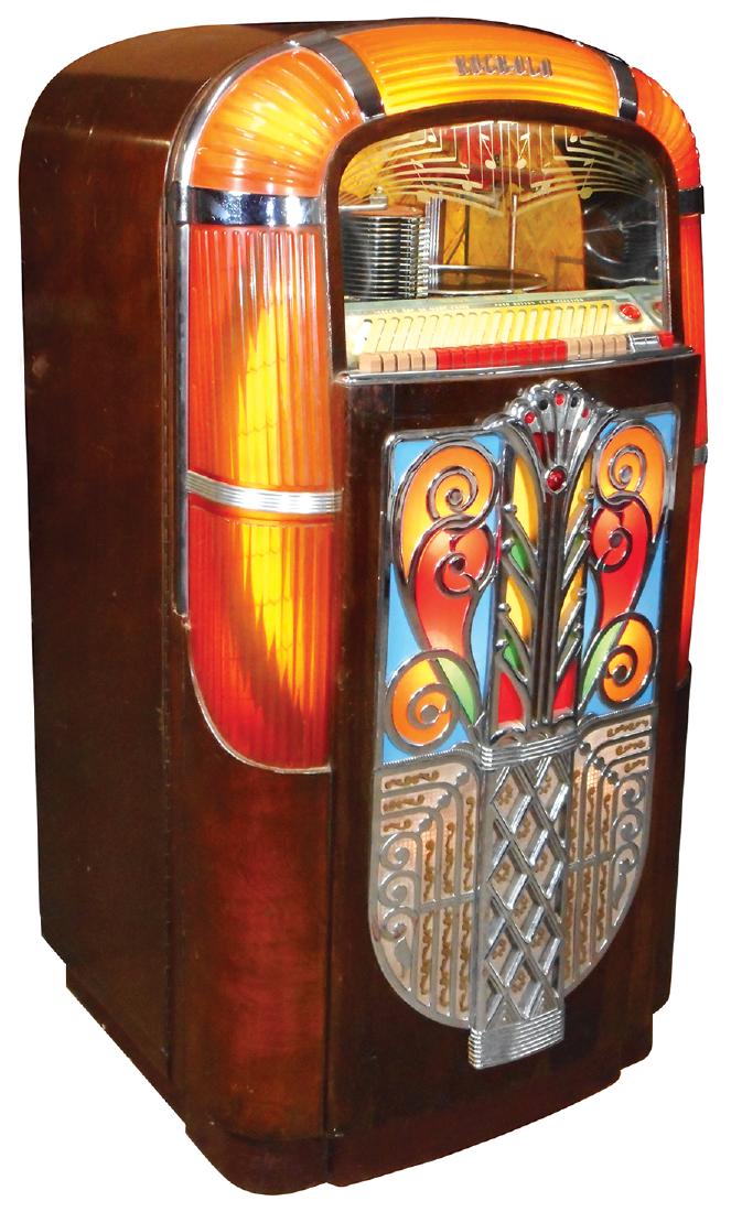 Coin-operated jukebox, Rockola Model 1426, c.1947, Good: Coin-operated jukebox, Rockola Model 1426, c.1947, Good ribbed amber plastics, great Art Deco front w/chrome center, jewels & light-up plastic inserts, interior shows a theatrical stage background & 2