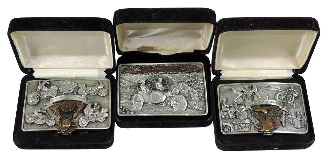 Harley-Davidson Limited Edition belt buckles (3), 1936: Harley-Davidson Limited Edition belt buckles (3), 1936 Knucklehead, 1984 V2 Evolution & 1919 Sales Brochure Cover, all created for Harley-Davidson by Brookfield Collector's Guild in 1983, all Exc cond