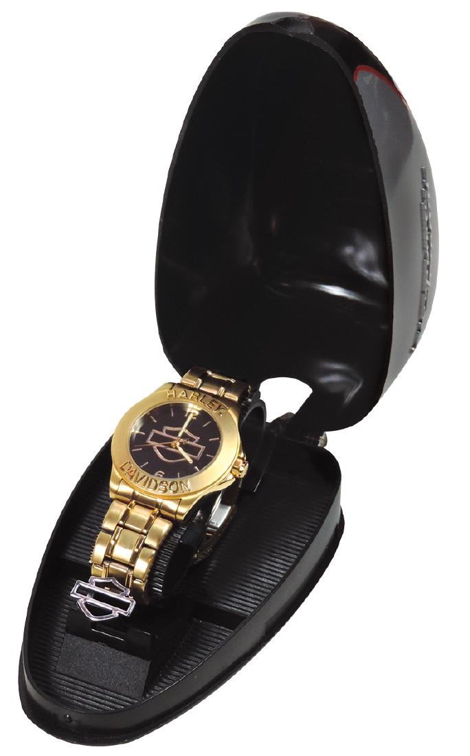 Harley-Davidson watch in gas tank case, gold tone watch: Harley-Davidson watch in gas tank case, gold tone watch has black face w/H-D Bar & Shield logo, Harley-Davidson embossed on bezel, marked Model HDDM301 on back, gold tone slide-bar band w/H-D logo, co