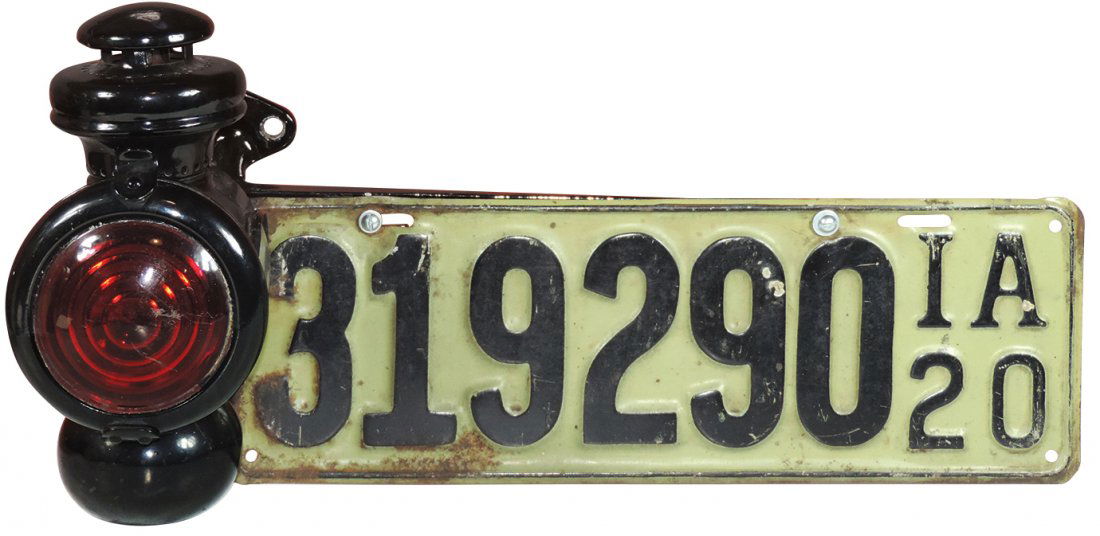 Automotive, 1916-1925 Model T Ford tail light assembly: Automotive, 1916-1925 Model T Ford tail light assembly w/an IA 1920 plate, Exc cond, 10"H x 20"W.