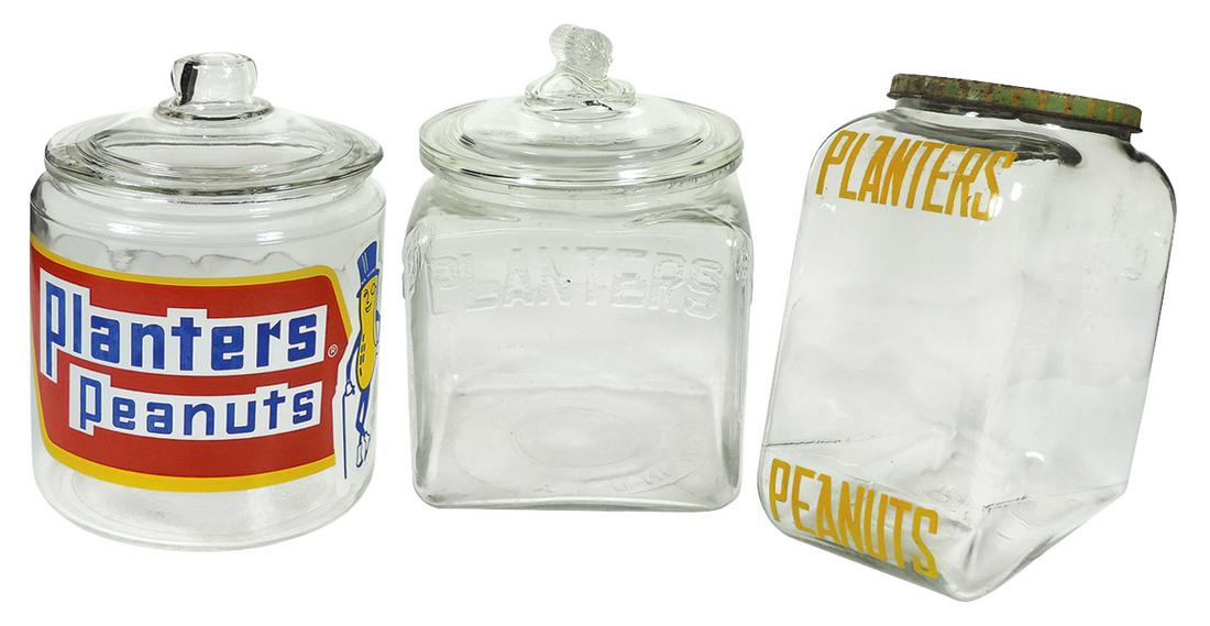 Country store Planters Peanut counter jars (3), all: Country store Planters Peanut counter jars (3), all glass w/lids, square jar has very minor roughness on interior lip, metal lid Good cond rest Exc cond unless noted, up to 10"H.