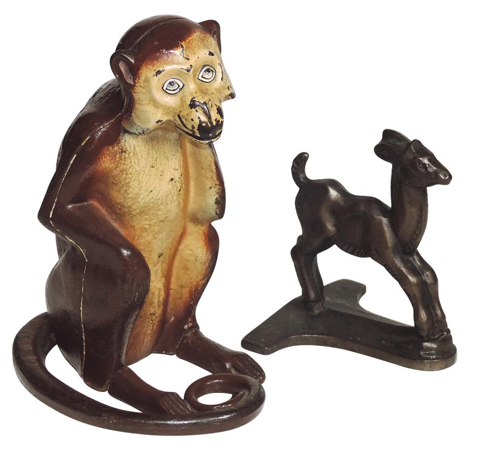 Cast iron doorstops (2), seated monkey w/curled tail,: Cast iron doorstops (2), seated monkey w/curled tail, orig paint, 8.5"H & Gazelle w/bronze wash, 5.5"H, both Exc cond.
