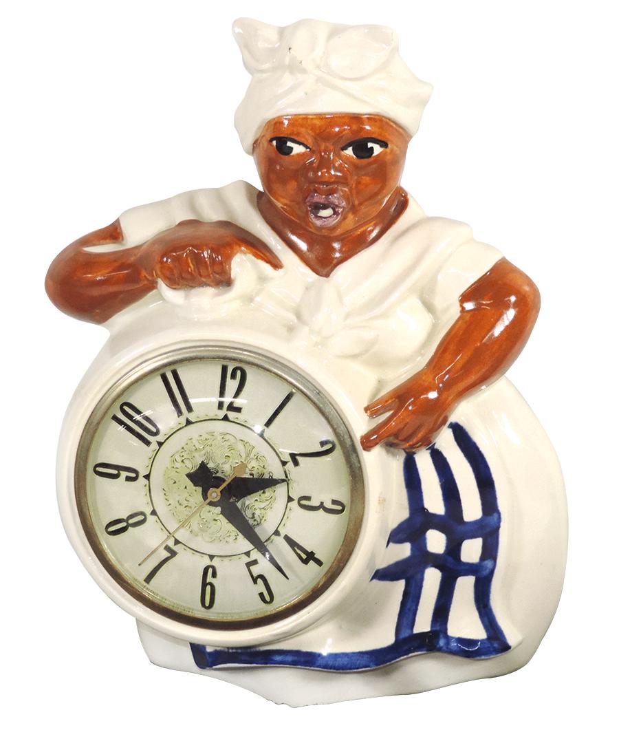 Black Americana Red Wing Mammy clock w/Lanshire: Black Americana Red Wing Mammy clock w/Lanshire movement, ceramic, electric, cosmetically Exc but clock does not run, 10"H x 8"W.