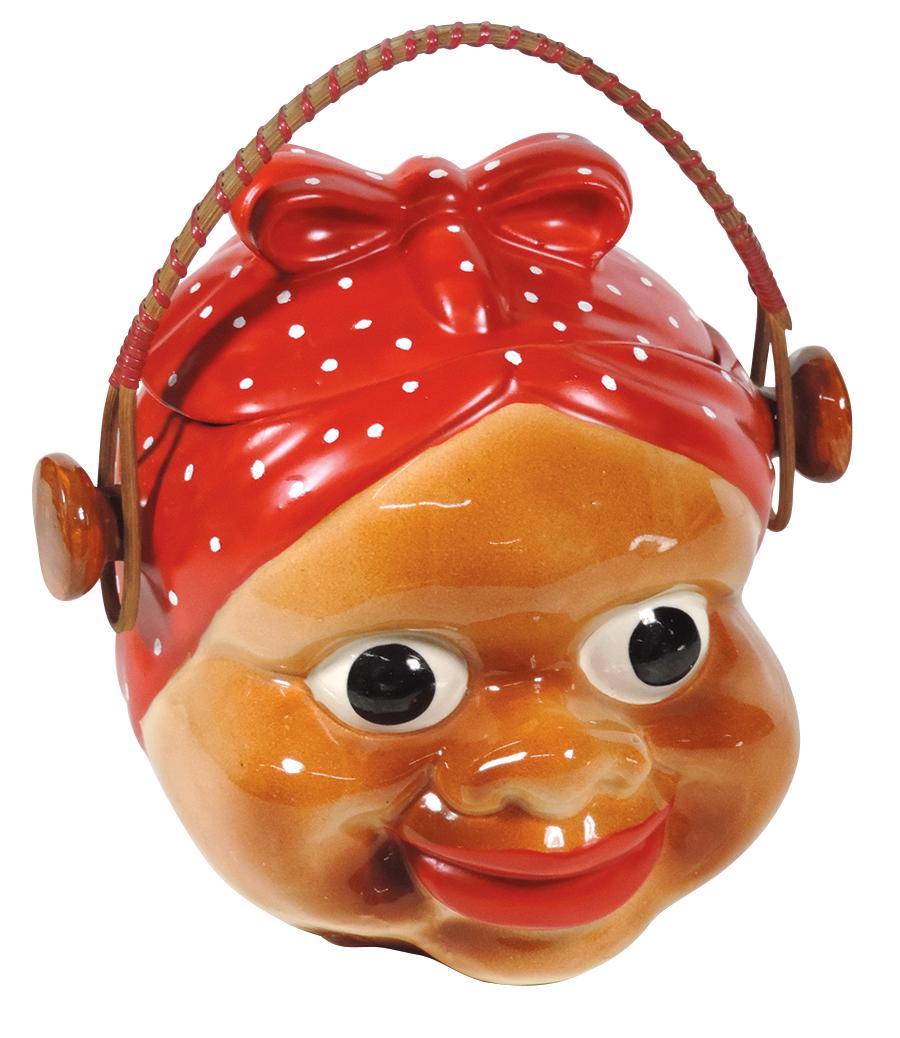 Black Americana Googley-eyed Aunt Jemima cookie jar,: Black Americana Googley-eyed Aunt Jemima cookie jar, smiling brown face wearing red polka-dot bandana, ceramic w/wicker bail handle, marked "Made in Japan" on bottom, Exc cond, 9.5"H.