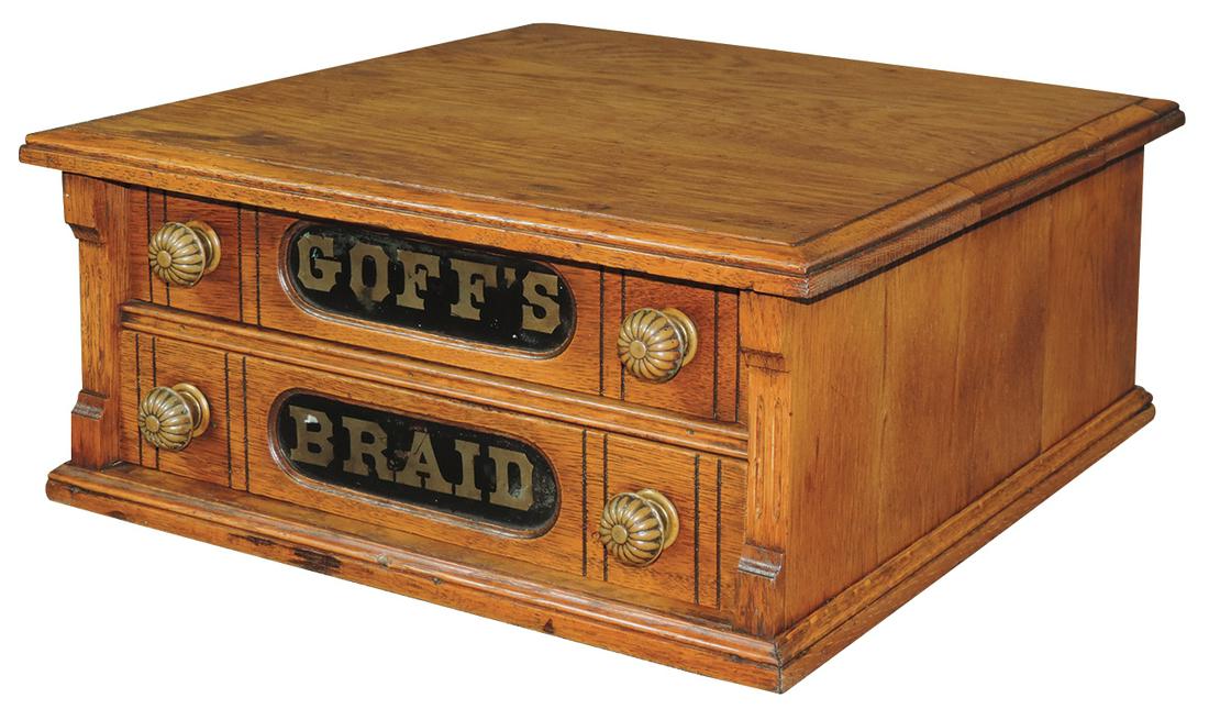 Country store braid cabinet, Goff's Braid, oak 2 drwr: Country store braid cabinet, Goff's Braid, oak 2 drwr w/adv on both front & back, orig mushroom pulls, Exc cond, 8"H x 17.5"W x 18.5"D.