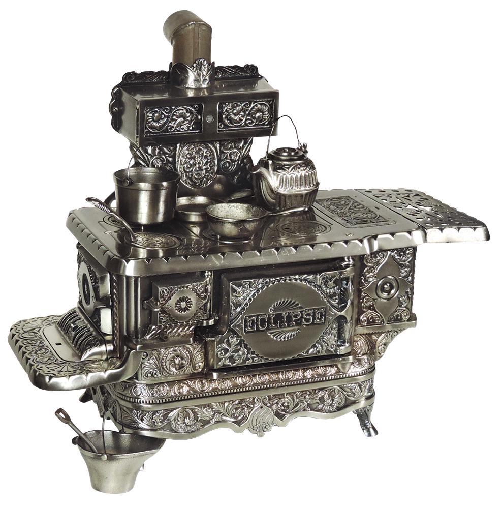 Child's stove, Eclipse, largest size that J.&E. Stevens: Child's stove, Eclipse, largest size that J.&E. Stevens made of beautiful engraved ranges, produced from the 1890's to 1920's, nickel-plated cast iron 6-burner w/reservoir, all parts present, comes w/