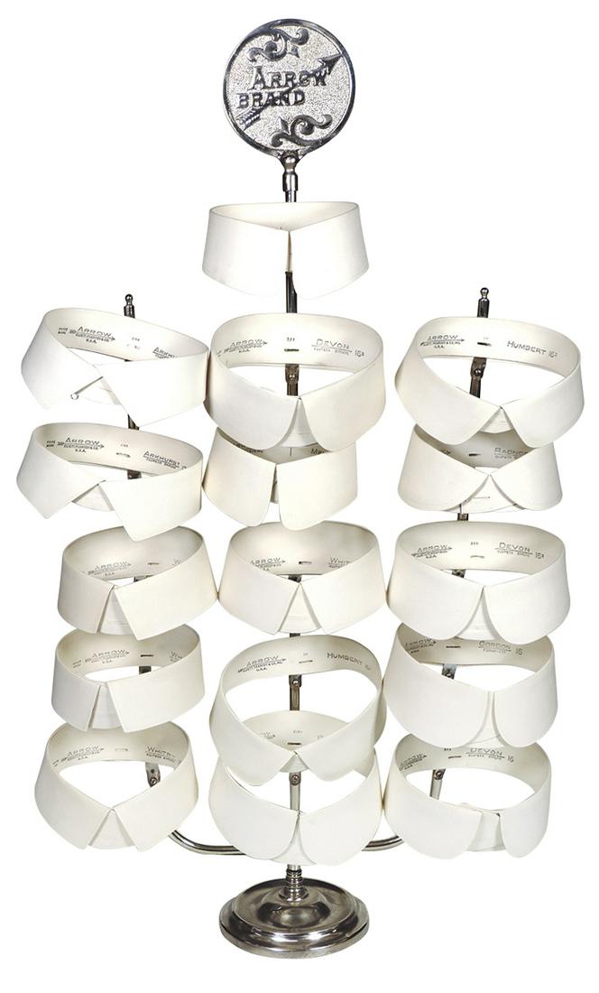 Country store collar display, Arrow Brand, nickel plate: Country store collar display, Arrow Brand, nickel-plated metal, includes 16 NOS Arrow collars, Exc cond, stand 31"H x 12"W.