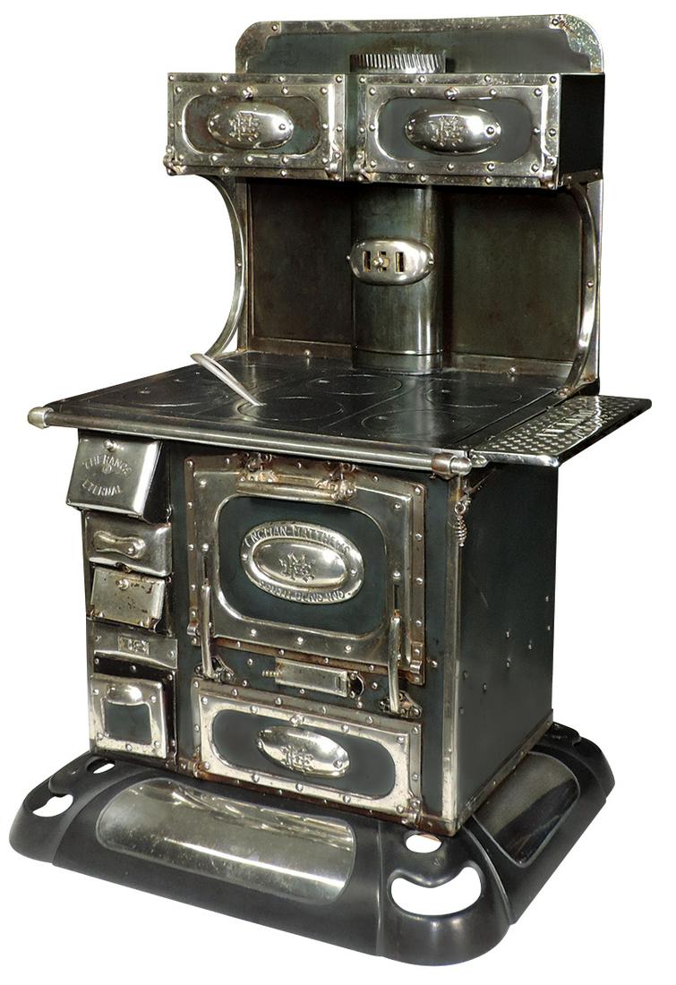 Salesman sample stove, Engman-Matthews "The Range: Salesman sample stove, Engman-Matthews "The Range Eternal #18", cast iron 6-burner w/warming oven, mfgd in South Bend, IN, c.1910, Exc cond w/ E.M.R.CO. shelf, 33"H x 21.5"W.